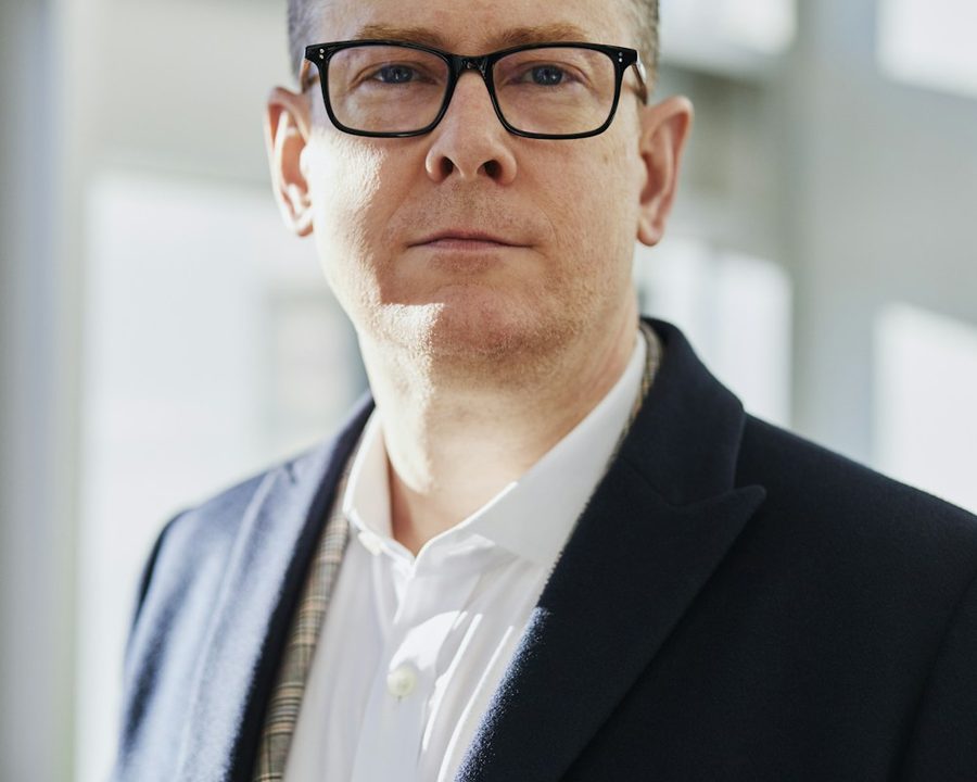 Studio portrait of a man with a neat short haircut